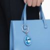 Porte-clés à cristal taillé ovale, bleu, finition métaux mélangés Porte-clés à cristal taillé ovale, bleu, finition métaux mélangés